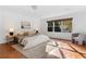 Serene main bedroom with a large window and elegant furnishings at 1824 Windemere Ne Dr, Atlanta, GA 30324