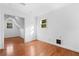 Bedroom with hardwood floors features natural light and attached attic space at 1824 Windemere Ne Dr, Atlanta, GA 30324