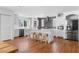 Bright kitchen with an island, stainless steel appliances, white cabinetry, and hardwood floors at 1824 Windemere Ne Dr, Atlanta, GA 30324