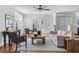 Cozy living room with hardwood floors, a neutral sofa, and glass doors leading to the backyard at 1824 Windemere Ne Dr, Atlanta, GA 30324