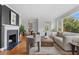 Elegant living room featuring a fireplace, hardwood floors, and an inviting seating area at 1824 Windemere Ne Dr, Atlanta, GA 30324