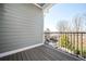 Balcony with wood flooring and wrought iron railings at 2119 Dee Dee Muse Nw Ln, Atlanta, GA 30318