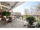 Outdoor balcony with ceiling fans, complemented by an elegant wrought iron railing overlooking the cityscape at 2119 Dee Dee Muse Nw Ln, Atlanta, GA 30318