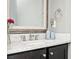 Bathroom with marble countertop, classic fixtures, and dark vanity at 2119 Dee Dee Muse Nw Ln, Atlanta, GA 30318