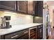 Kitchen featuring a built-in wine cooler, stainless steel refrigerator, and marble countertops at 2119 Dee Dee Muse Nw Ln, Atlanta, GA 30318