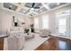 Bright and open living room with coffered ceiling, hardwood floors, and stylish contemporary furniture at 2119 Dee Dee Muse Nw Ln, Atlanta, GA 30318