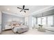 Calm main bedroom features natural light, sitting area, carpet flooring and neutral color palette at 2119 Dee Dee Muse Nw Ln, Atlanta, GA 30318