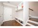 Mudroom with a bench, shoe storage, coat hooks, and stairs at 2119 Dee Dee Muse Nw Ln, Atlanta, GA 30318