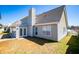 View of a backyard with a patio, a storage shed, and lush greenery at 104 Providence Dr, Carrollton, GA 30116