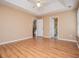 Large bedroom with hardwood floors, natural light, and ensuite access at 104 Providence Dr, Carrollton, GA 30116