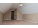 A carpeted bedroom includes a doorway, and a ceiling fan with lights at 104 Providence Dr, Carrollton, GA 30116