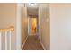 Hallway features neutral walls, carpet, and white trim, leading to other rooms at 104 Providence Dr, Carrollton, GA 30116