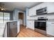 Updated kitchen featuring stainless steel appliances and plenty of cabinet space at 104 Providence Dr, Carrollton, GA 30116