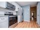 Modern kitchen with stainless steel appliances and tile backsplash at 104 Providence Dr, Carrollton, GA 30116