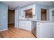 White cabinets and stainless steel appliances make this kitchen sleek and efficient at 104 Providence Dr, Carrollton, GA 30116