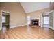 Bright living room with hardwood floors and brick fireplace at 104 Providence Dr, Carrollton, GA 30116