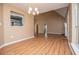 Light-filled living room with hardwood floors and cozy fireplace at 104 Providence Dr, Carrollton, GA 30116