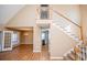 Open-concept living room with hardwood floors and staircase at 104 Providence Dr, Carrollton, GA 30116