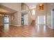 Spacious living room featuring wood floors, high ceilings, and an open layout at 104 Providence Dr, Carrollton, GA 30116