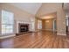 Open living area with brick fireplace and natural light at 104 Providence Dr, Carrollton, GA 30116