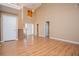 Bright living room with wood flooring, high ceilings, and multiple doorways at 104 Providence Dr, Carrollton, GA 30116