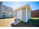 Image of shed with siding and ramp, in backyard at 104 Providence Dr, Carrollton, GA 30116