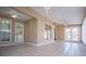 Large sunroom with white framed windows and white tile floors at 104 Providence Dr, Carrollton, GA 30116