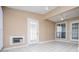 Cozy sunroom with white tile flooring and multiple windows at 104 Providence Dr, Carrollton, GA 30116