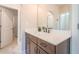 Bathroom vanity features a white countertop, dark wood cabinets, and a large mirror at 513 Beecham Dr, Smyrna, GA 30082