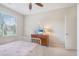 Comfortable bedroom featuring a bed with rainbow patterned cover and dresser with TV at 513 Beecham Dr, Smyrna, GA 30082