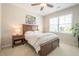 Bedroom featuring carpeted floors, a large window, and a wood bed frame at 513 Beecham Dr, Smyrna, GA 30082