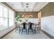 Elegant dining room featuring coffered ceilings, modern lighting and hardwood flooring at 513 Beecham Dr, Smyrna, GA 30082