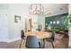 Modern dining area showcasing hardwood floors, stylish lighting, and comfortable seating arrangements at 513 Beecham Dr, Smyrna, GA 30082