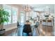 Open-concept dining area adjacent to a kitchen with hardwood floors and natural light at 513 Beecham Dr, Smyrna, GA 30082