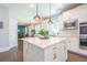 Kitchen with stainless steel appliances, a view to the dining room, and a bright kitchen island at 513 Beecham Dr, Smyrna, GA 30082