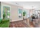 Comfortable living room area features hardwood floors, many windows, and a view of the kitchen at 513 Beecham Dr, Smyrna, GA 30082