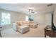 Spacious living room with comfortable sofa, entertainment center, and ample natural light at 513 Beecham Dr, Smyrna, GA 30082