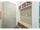 Mudroom with sage green storage, shelving, coat hooks, and woven storage baskets near the home's entry at 513 Beecham Dr, Smyrna, GA 30082