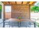 Inviting outdoor dining area featuring a wooden table, stylish seating, and decorative string lights under a covered patio at 513 Beecham Dr, Smyrna, GA 30082