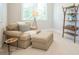 Cozy sitting area features neutral decor, an accent chair, and a bookshelf at 513 Beecham Dr, Smyrna, GA 30082