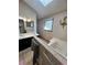 Bathroom with double sink vanity, soaking tub, and patterned wallpaper create a relaxing space at 92 Indian Lake Ct, Hiram, GA 30141