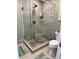 Bathroom with a stand-up glass shower with tiled walls and pebble floor at 92 Indian Lake Ct, Hiram, GA 30141