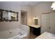 Bathroom featuring a large tub, vanity, and shower at 92 Indian Lake Ct, Hiram, GA 30141