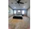 Spacious bedroom with three windows that provide natural light, with a ceiling fan at 92 Indian Lake Ct, Hiram, GA 30141