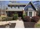 Charming two-story home featuring stone accents, a covered porch, and manicured landscaping at 92 Indian Lake Ct, Hiram, GA 30141