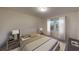 Cozy bedroom featuring neutral tones, a comfortable bed, and natural light, creating a serene retreat at 162 Sonoma Drive, Dallas, GA 30157