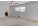 Bedroom featuring two windows and neutral carpet at 2685 Whippoorwill Cir, Duluth, GA 30097