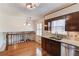 Kitchen with stainless steel dishwasher, granite counters, and wooden floors at 2685 Whippoorwill Cir, Duluth, GA 30097