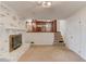 Carpeted living room with white brick fireplace at 2685 Whippoorwill Cir, Duluth, GA 30097