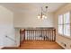 Living room with wooden railing overlooking lower room at 2685 Whippoorwill Cir, Duluth, GA 30097